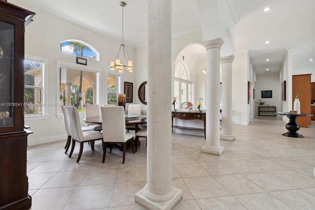 dining space featuring crown molding, a towering ceiling, light tile patterned flooring, and a chandelier