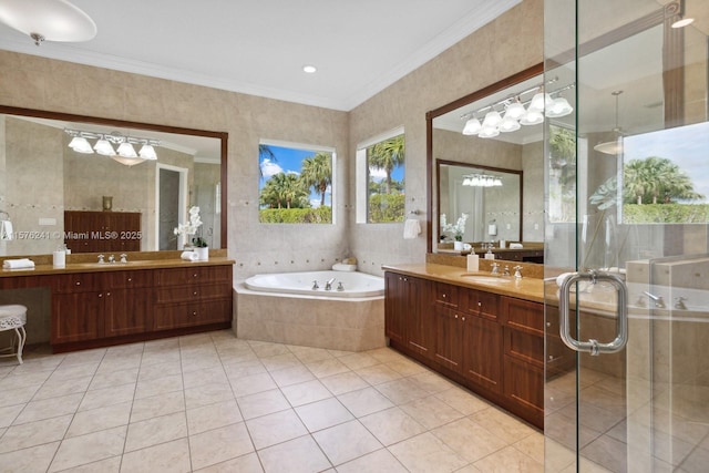 bathroom with plus walk in shower, vanity, tile patterned floors, and ornamental molding