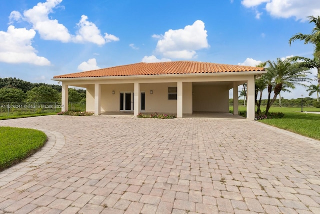 rear view of house with a carport