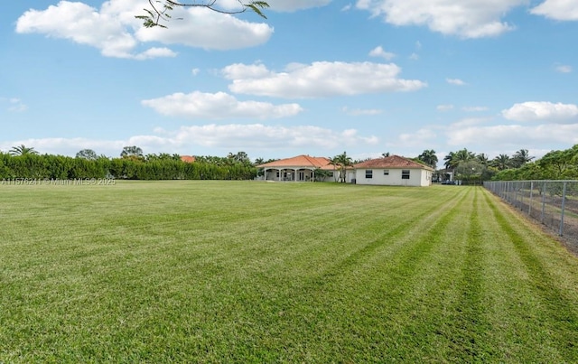 view of yard with a rural view