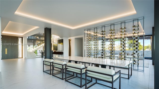 dining space featuring a tray ceiling