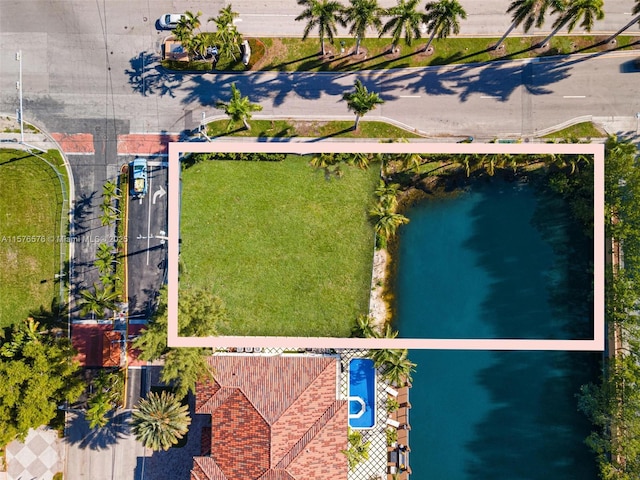 birds eye view of property featuring a water view