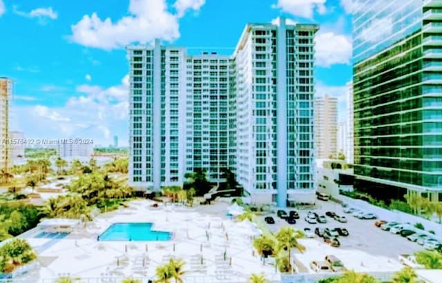 birds eye view of property with a view of the beach and a water view