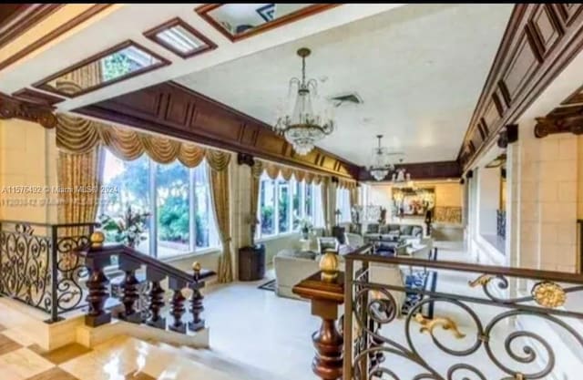 sunroom with an inviting chandelier