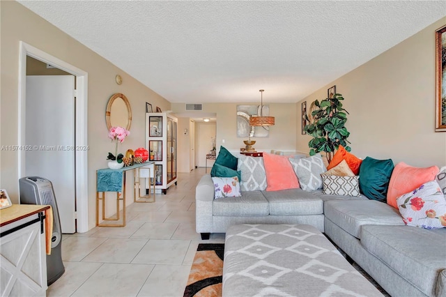 tiled living room with a textured ceiling