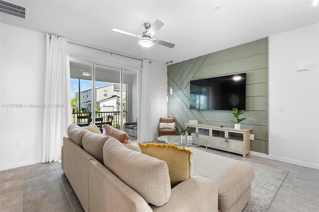 living room with ceiling fan and tile floors