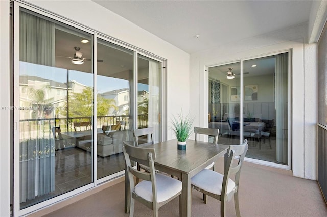 dining space featuring carpet and ceiling fan