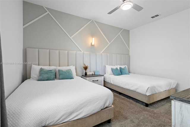 bedroom with dark carpet and ceiling fan