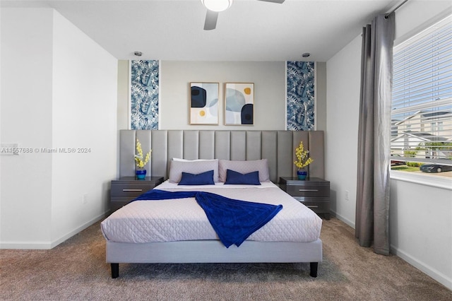 bedroom with ceiling fan and carpet floors