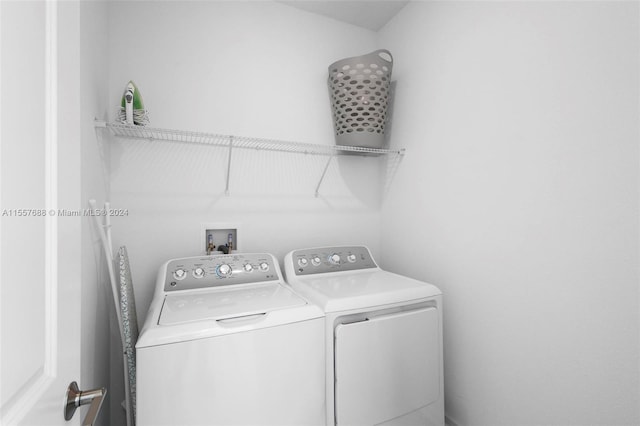 washroom with hookup for a washing machine and separate washer and dryer