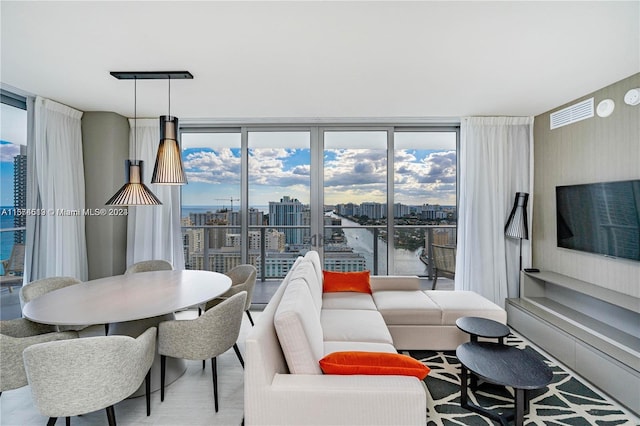 living room featuring floor to ceiling windows