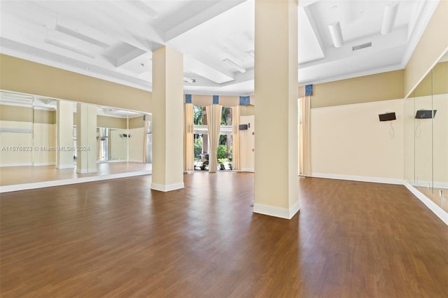 exercise area featuring coffered ceiling and dark hardwood / wood-style floors