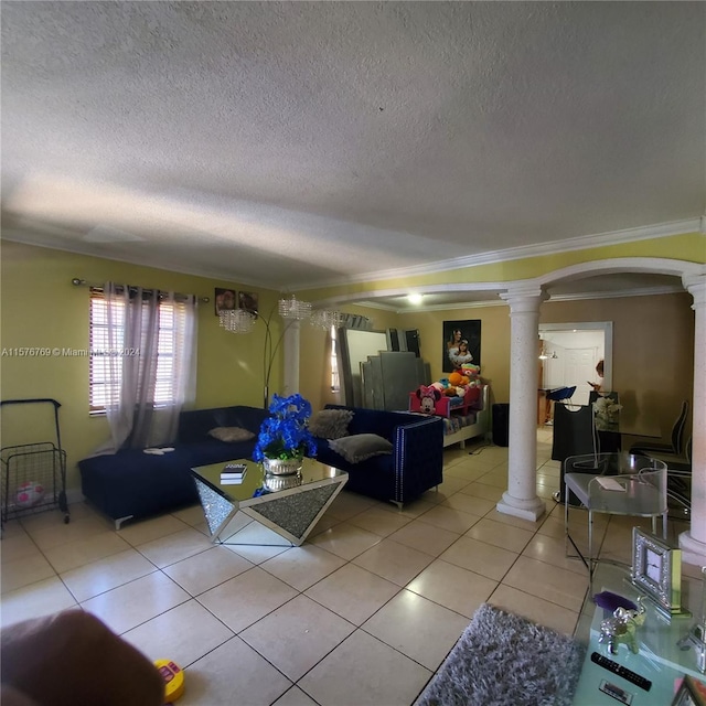 living room featuring crown molding, a textured ceiling, decorative columns, and tile floors