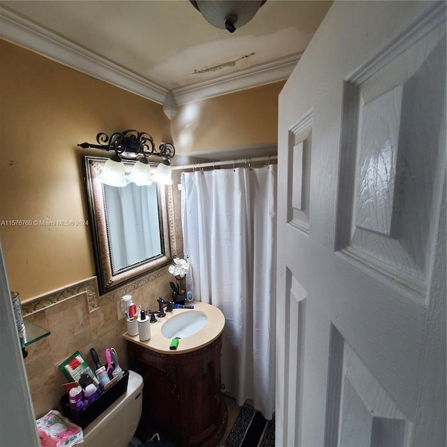 bathroom featuring ornamental molding, tile walls, toilet, and large vanity