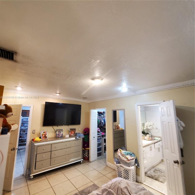 living room with crown molding and light tile floors