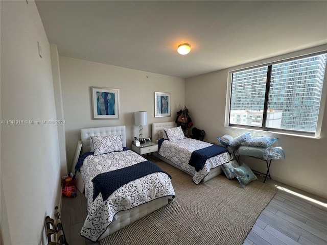 bedroom featuring hardwood / wood-style flooring