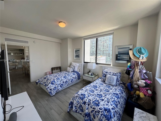 bedroom with hardwood / wood-style flooring