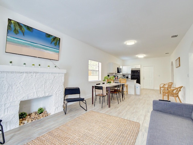 living room with light hardwood / wood-style flooring