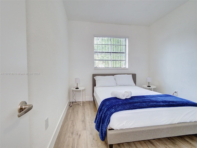 bedroom with light hardwood / wood-style floors