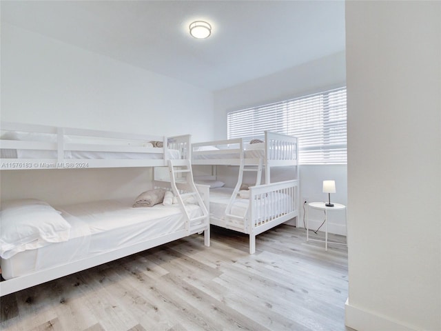 bedroom with hardwood / wood-style floors