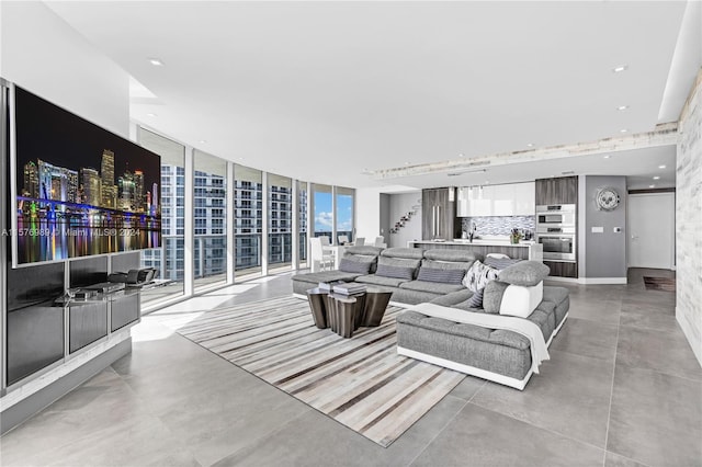 tiled living room with floor to ceiling windows