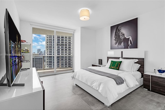 bedroom featuring access to outside and expansive windows