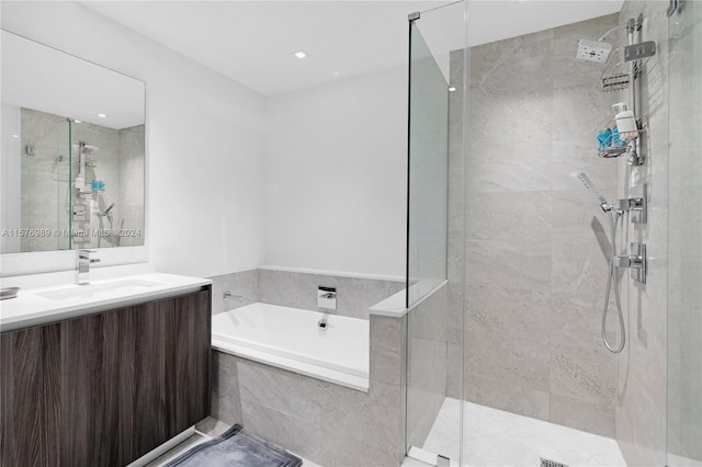 bathroom with independent shower and bath and oversized vanity