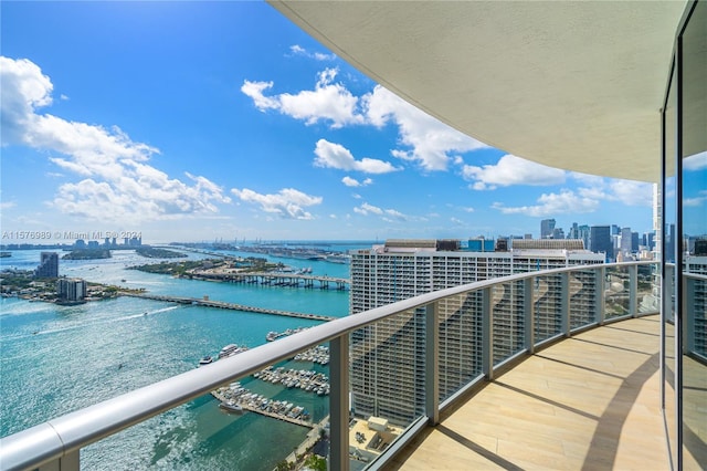 balcony featuring a water view