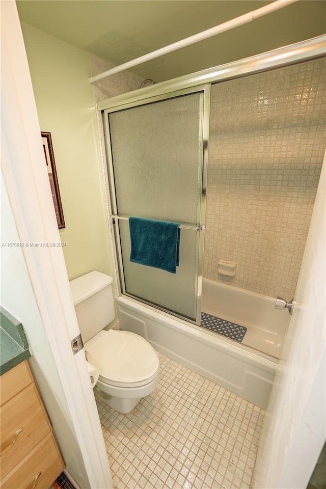 bathroom with tile flooring and toilet