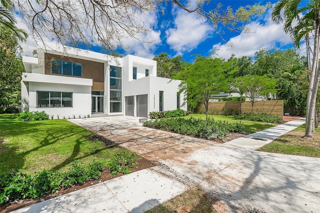 contemporary house with a front yard