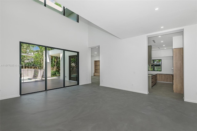 empty room featuring a high ceiling