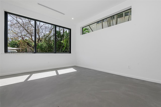 empty room featuring concrete flooring