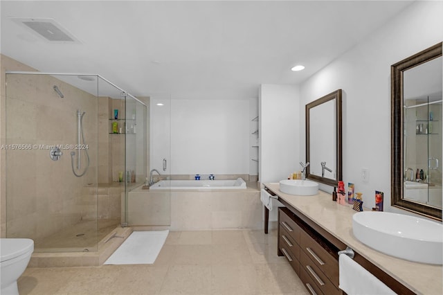 full bathroom with dual sinks, oversized vanity, shower with separate bathtub, toilet, and tile floors