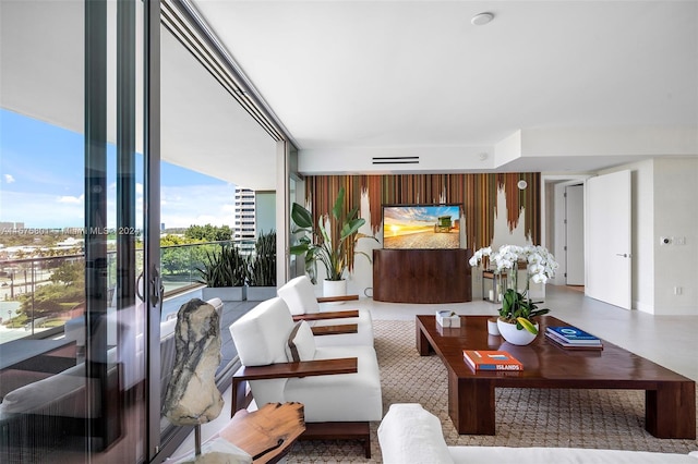 living room featuring floor to ceiling windows