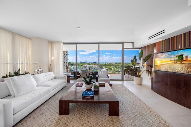 living room with tile flooring and expansive windows