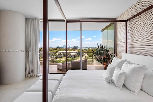 tiled bedroom with floor to ceiling windows and access to exterior