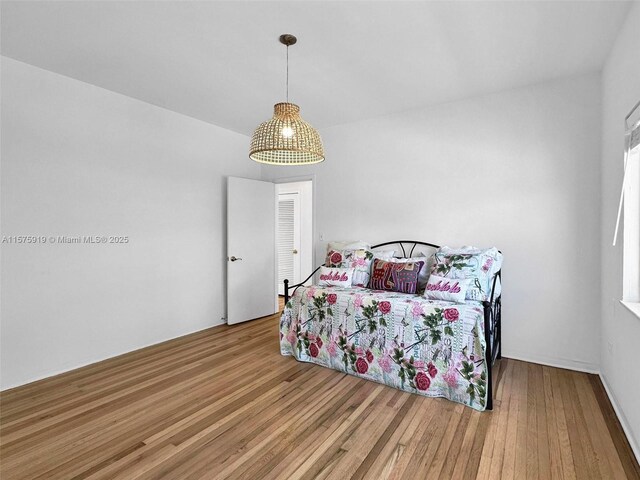 bedroom with hardwood / wood-style floors