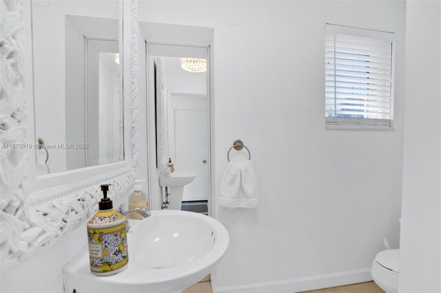 bathroom featuring sink and toilet