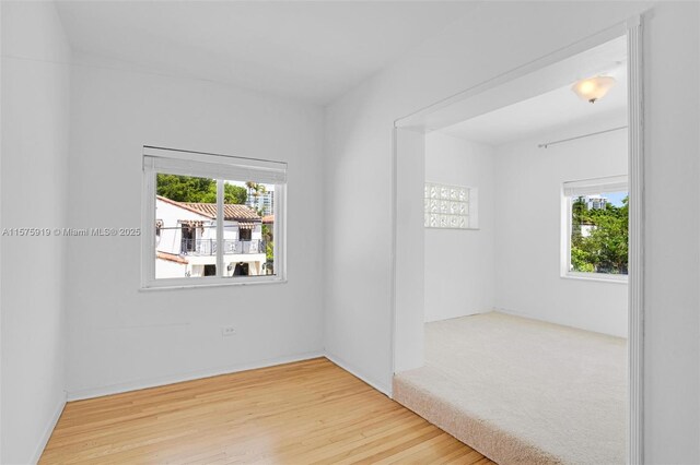 empty room with hardwood / wood-style floors