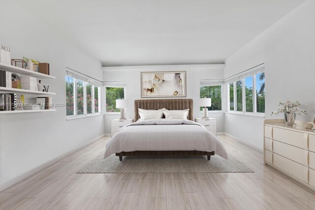 bedroom featuring light wood-type flooring and multiple windows