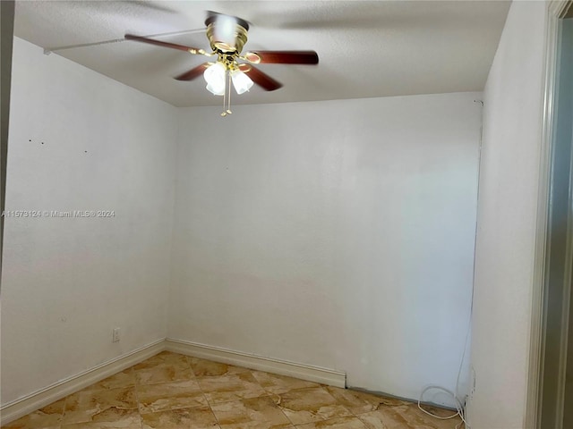 unfurnished room featuring ceiling fan and light tile floors