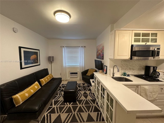 tiled living room featuring sink