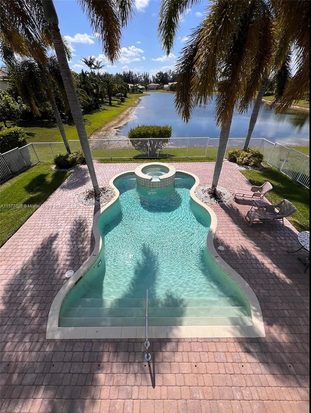 view of swimming pool featuring a water view, an in ground hot tub, and a patio area