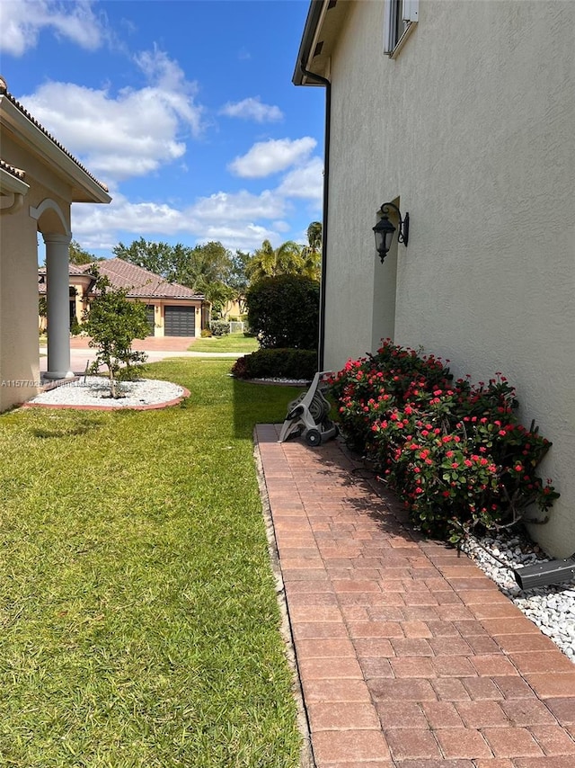 view of yard with a garage