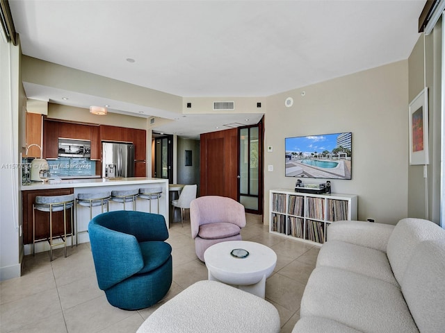 living room featuring light tile patterned floors