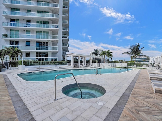 view of pool featuring a community hot tub