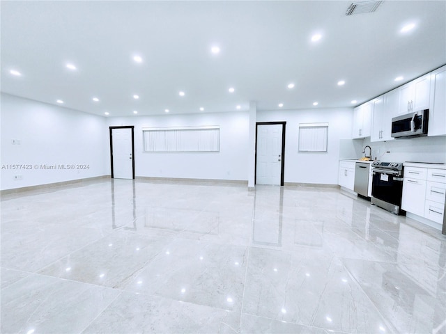 interior space with sink and light tile floors