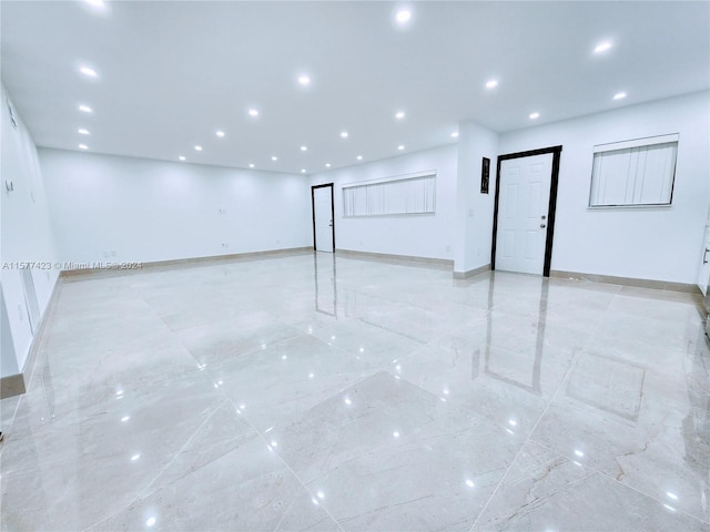 basement featuring light tile flooring