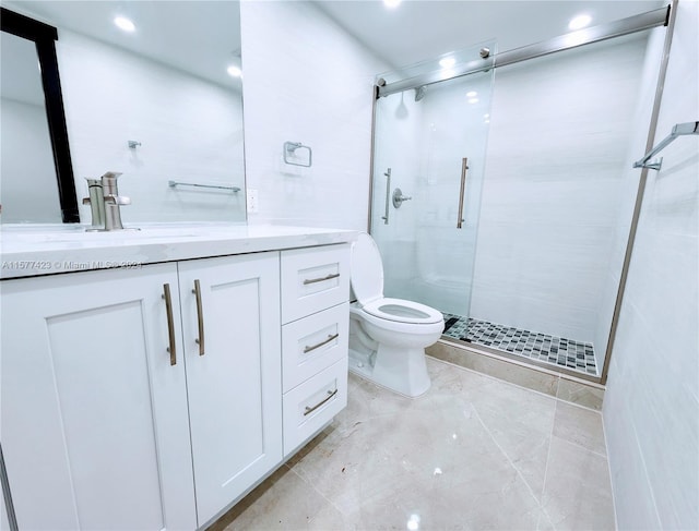 bathroom featuring walk in shower, vanity, toilet, and tile flooring