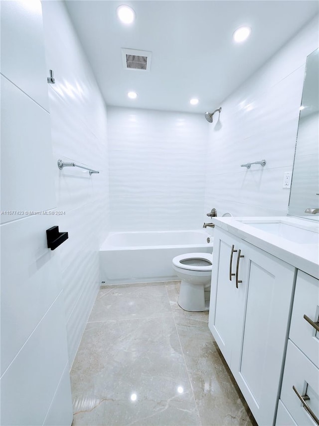 full bathroom with vanity, toilet, tiled shower / bath, and tile flooring